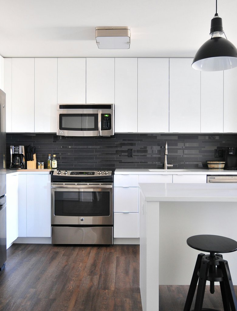 Final alignment & safety checks on new range and fridge