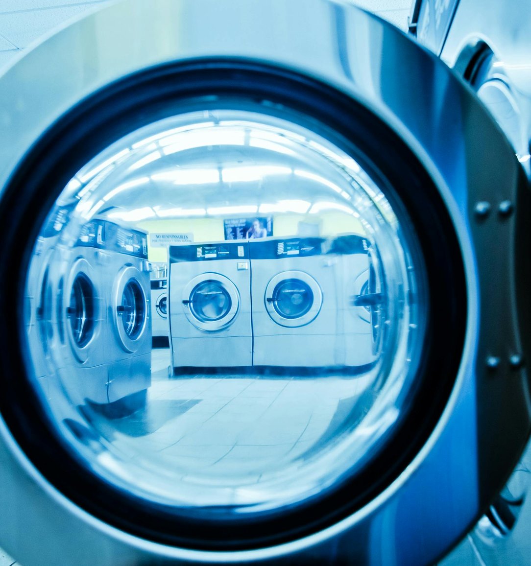 Appliance repair technician diagnosing a household appliance